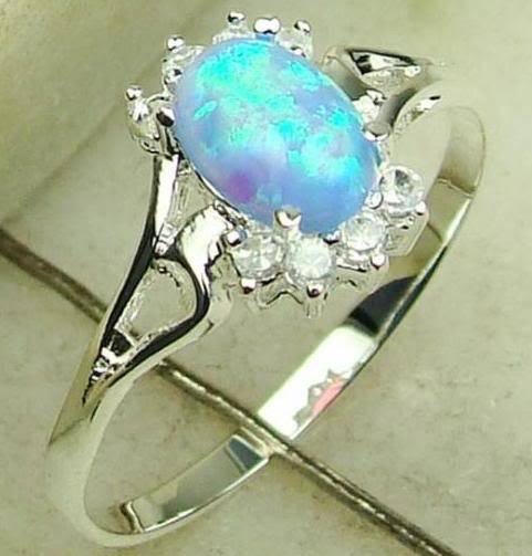 MARYKAY - GORGEOUS  BLUE FIRE OPAL RING SET IN STERLING SILVER