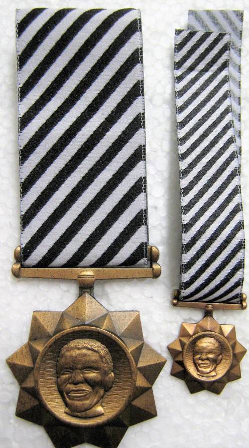 S.A. NATIONAL DEFENCE FORCE "THE ATTENDANCE OF MANDELA FUNERAL" MEDALS. NUMBERED FULL SIZE & MINI