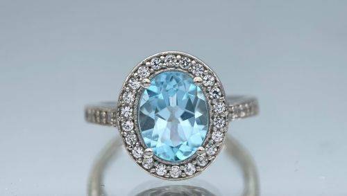 RETAIL:R3500 - NATURAL AQUAMARINE SILVER CZ HALO ETERNITY RING