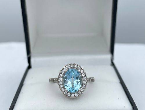RETAIL:R3500 - NATURAL AQUAMARINE SILVER CZ HALO ETERNITY RING