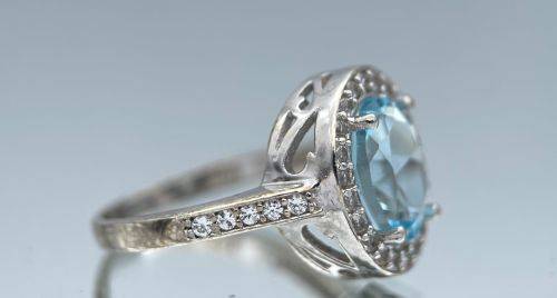 RETAIL:R3500 - NATURAL AQUAMARINE SILVER CZ HALO ETERNITY RING