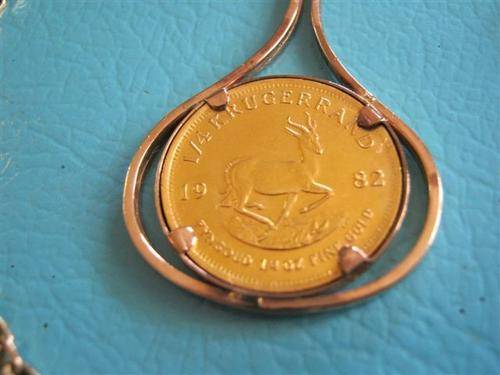Qtr oz Kruger coin in pendant with Chain (total weight with chain etc +- 26 grs)