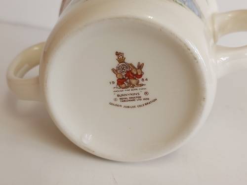 AWESOME ROYAL DOULTON BUNNYKINS TWIN HANDLE MUG WITH BRIGHT AND VIVID IMAGES