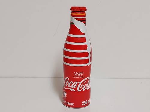 COMMEMORATIVE OLYMPICS METAL/ALUMINIUM COKE BOTTLE, SEALED AND FULL