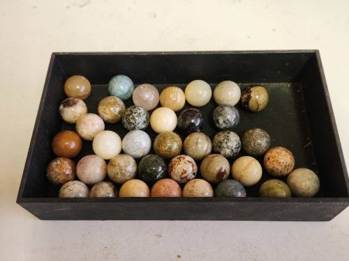 COLLECTION OF 37 HIGHLY POLISHED SEMI-PRECIOUS GEMSTONE SPHERES