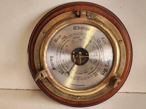 VINTAGE WEATHERMASTER WOOD AND BRASS PORTHOLE BAROMETER