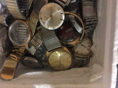 Box full of broken mechanical old watches