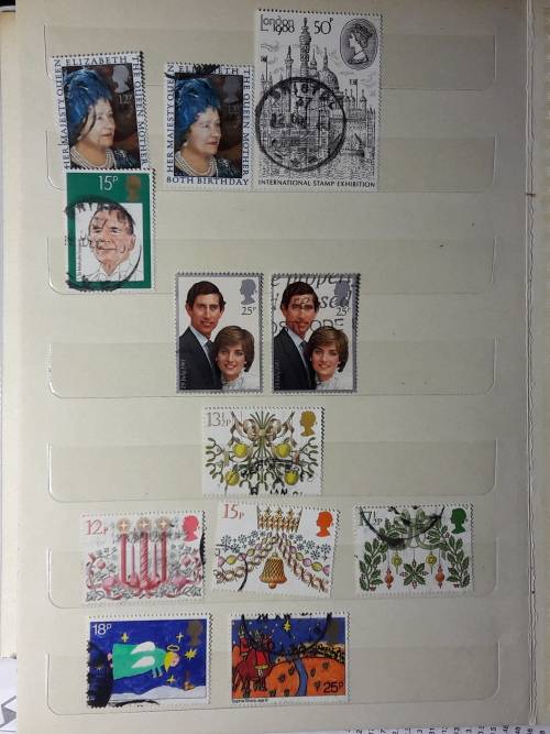 STAMP ALBUM WITH 230 STAMPS