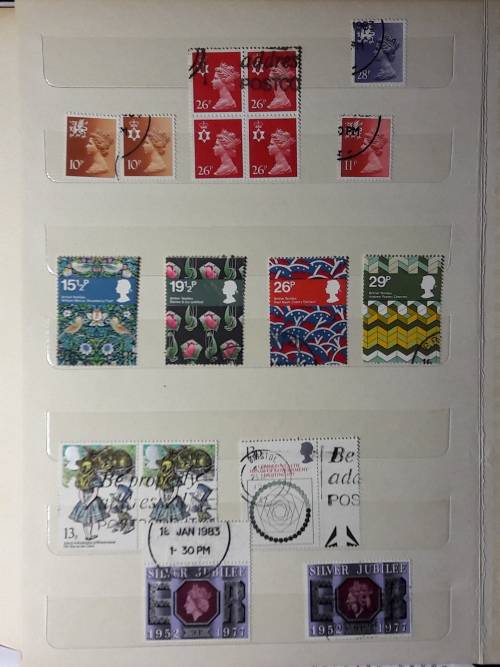 STAMP ALBUM WITH 230 STAMPS