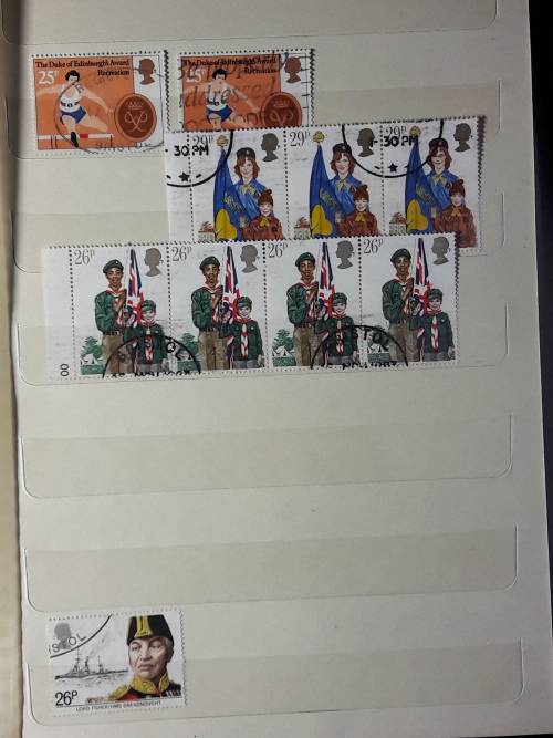 STAMP ALBUM WITH 230 STAMPS