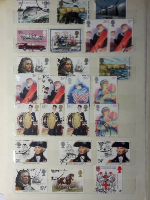 STAMP ALBUM WITH 230 STAMPS