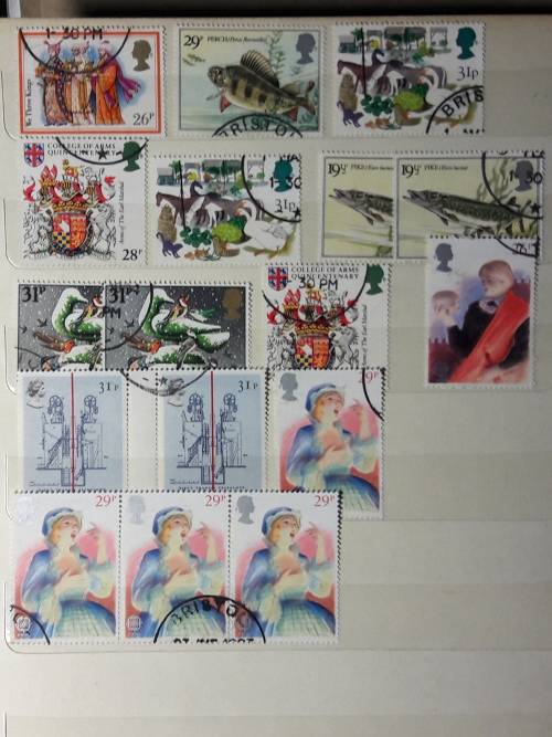 STAMP ALBUM WITH 230 STAMPS