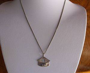 HOW DIFFERENT IS THIS ... A STERLING SILVER LESOTHO HUT PENDANT ON A STERLING SILVER NECKLACE