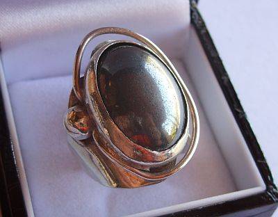 AN AMAZING THICK , WIDE , HEAVY STERLING SILVER RING - BLACK PEARL ?