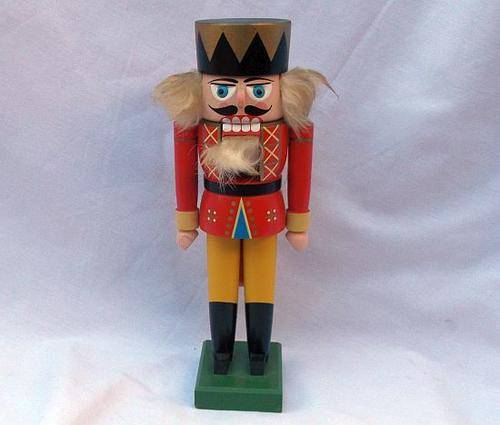 AN ADORABLE VINTAGE HAND CRAFTED WOODEN NUTCRACKER MADE IN GERMANY .....CRUNCH TIME ....