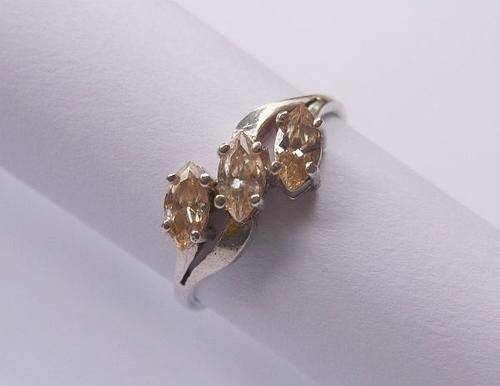 A CLASSY STERLING SILVER RING SET WITH MARQUISE CUT STONES WITH A YELLOWISH ORANGE TINGE !!! SWEET !