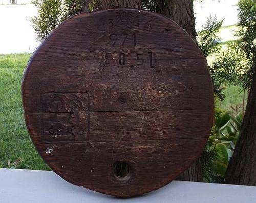WOW !! A VERY OLD WINE VAT LID FROM THE FARM ....LOOKS LIKE GERMAN STAMPS ...FOR THE BAR OR MAN CAVE
