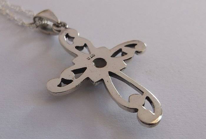 A STERLING SILVER NECKLACE PLUS A STERLING SILVER CROSS PENDANT...ONYX LOOK CENTER