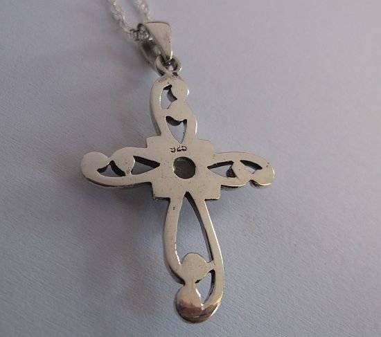 A STERLING SILVER NECKLACE PLUS A STERLING SILVER CROSS PENDANT...ONYX LOOK CENTER