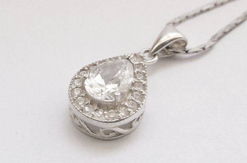 A vintage German silver necklace and a Sterling Silver pendant with a Fancy faceted Pear shape stone