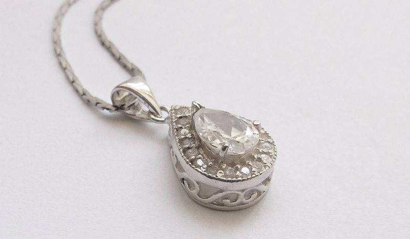 A vintage German silver necklace and a Sterling Silver pendant with a Fancy faceted Pear shape stone