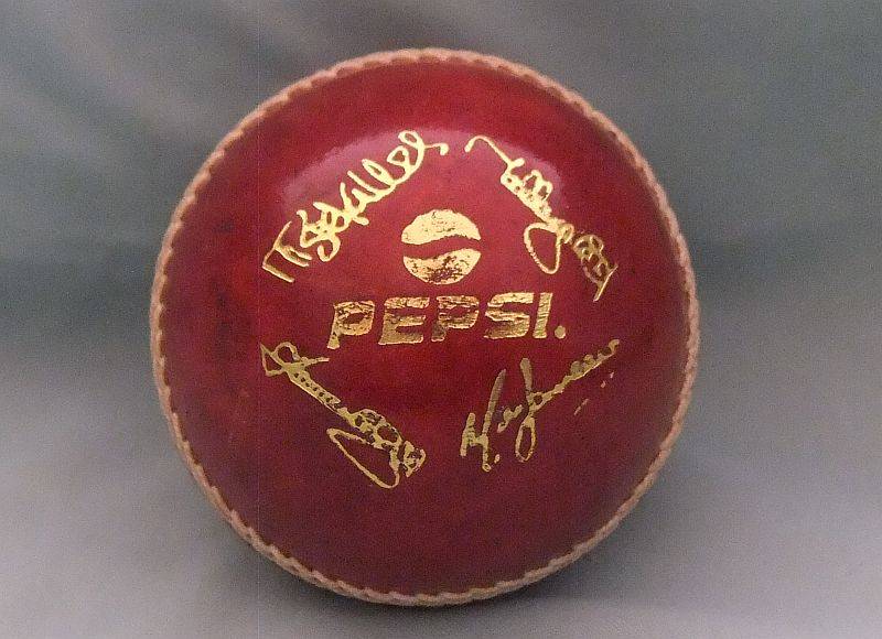 A COOL STANDARD SIZE CRICKET BALL WITH PEPSI ADVERTISING AND SIGNATURES - EXCELLENT CONDITION