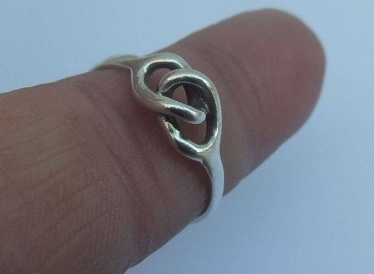 GREAT DEAL !! FOUR DIFFERENT SOLID STERLING SILVER RINGS !! BID FOR THE LOT !! WOW !!