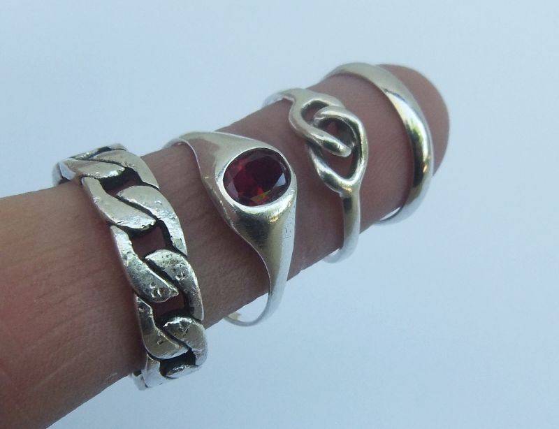 GREAT DEAL !! FOUR DIFFERENT SOLID STERLING SILVER RINGS !! BID FOR THE LOT !! WOW !!