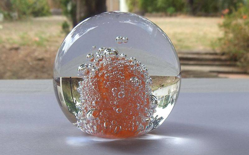 A DAMAGE FREE VINTAGE GENUINE MURANO SOLID GLASS PAPERWEIGHT WITH ORANGE "EXPLOSION " ...LOVE IT !!