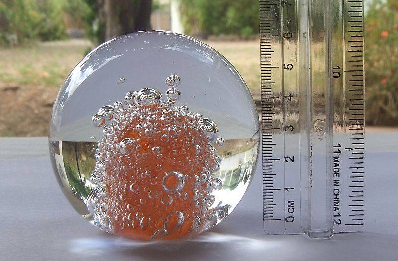 A DAMAGE FREE VINTAGE GENUINE MURANO SOLID GLASS PAPERWEIGHT WITH ORANGE "EXPLOSION " ...LOVE IT !!