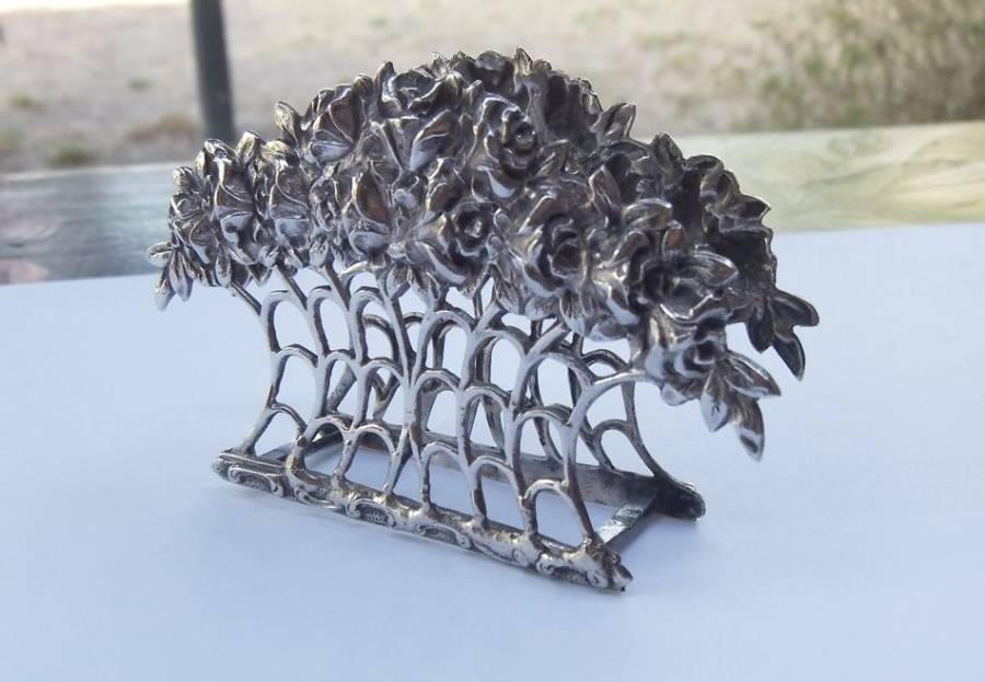 RARE FIND !! AN OLD SOLID 80% SILVER SERVIETTE OR LETTER HOLDER WITH INTRICATE ROSE DETAIL !!