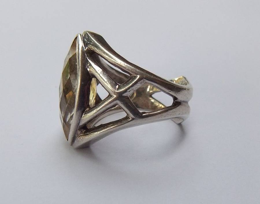 A UNIQUE SOLID STERLING SILVER RING SET WITH A LARGE FACETED STONE - POSSIBLY CITRINE - STAMPED !!