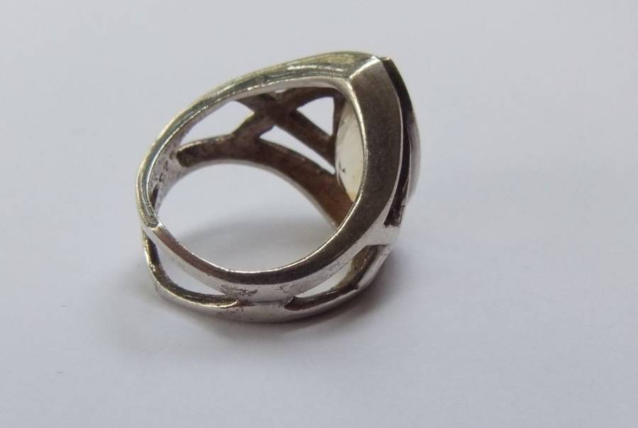 A UNIQUE SOLID STERLING SILVER RING SET WITH A LARGE FACETED STONE - POSSIBLY CITRINE - STAMPED !!