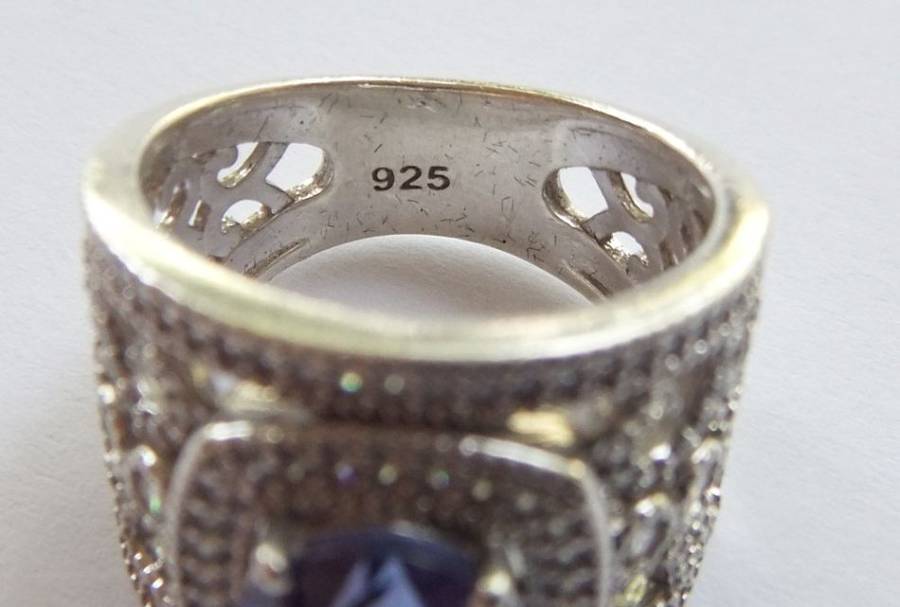 AN INCREDIBLE SOLID STERLING SILVER HALO RING SET WITH LOTS OF FACETED STONES !! MUST HAVE QUALITY !