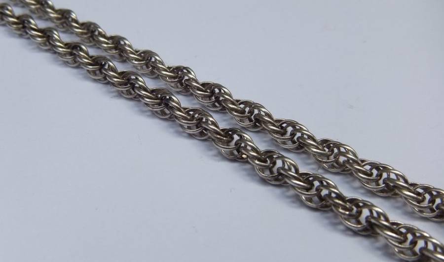 A STUPENDOUS SOLID STERLING SILVER JEWEL ENCRUSTED CROSS PENDANT WITH VINTAGE MULTI LINK NECKLACE