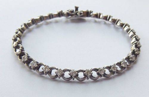 A CLASSY VINTAGE LOOK SOLID STERLING SILVER BRACELET WITH SAFETY CLASP AND FACETED STONES !! LOOK !!
