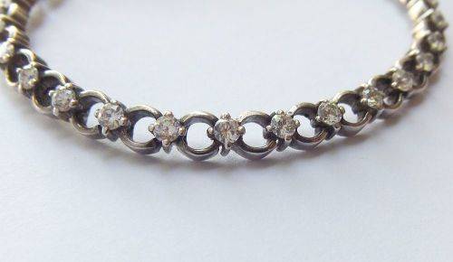 A CLASSY VINTAGE LOOK SOLID STERLING SILVER BRACELET WITH SAFETY CLASP AND FACETED STONES !! LOOK !!