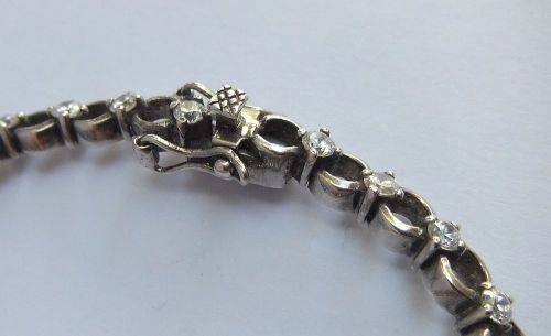 A CLASSY VINTAGE LOOK SOLID STERLING SILVER BRACELET WITH SAFETY CLASP AND FACETED STONES !! LOOK !!