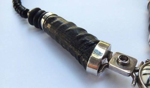A ONE OF A KIND BUCK HORN , BONE , TIGERS EYE , BLACK STONE AND STERLING SILVER NECKLACE !!