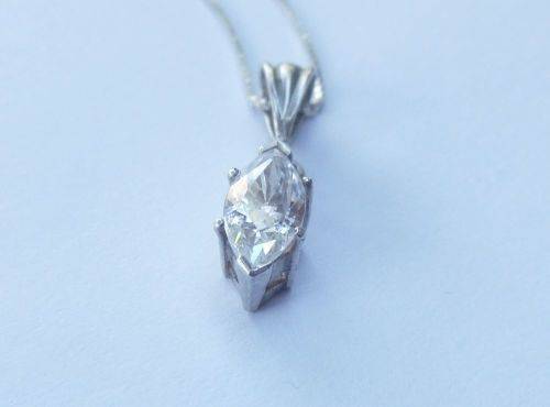 AN ELEGANT STERLING SILVER PENDANT SET WITH A MARQUISE CUT STONE PLUS A STERLING SILVER NECKLACE !!