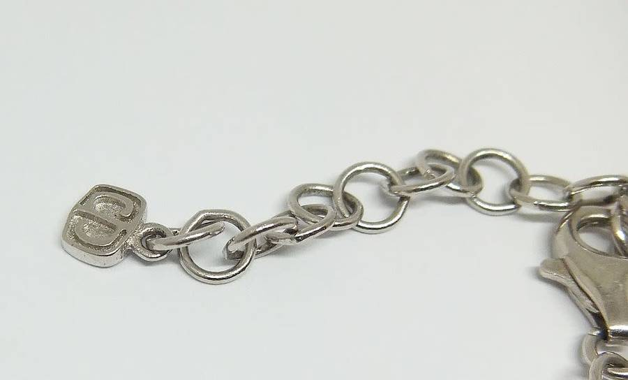 A MAGNIFICENT DESIGNER STERLING SILVER BRACELET SET WITH FACETED BLUEISH PEAR SHAPED STONES !! WOW !