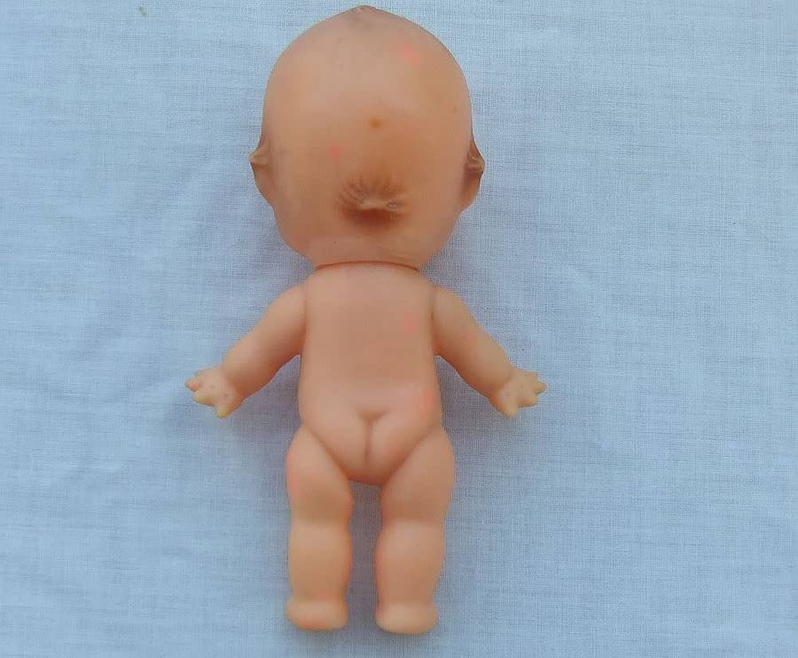 Three vintage Kewpie dolls for display