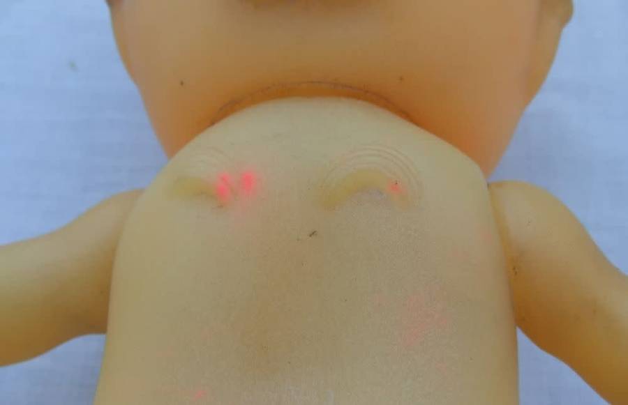 Three vintage Kewpie dolls for display