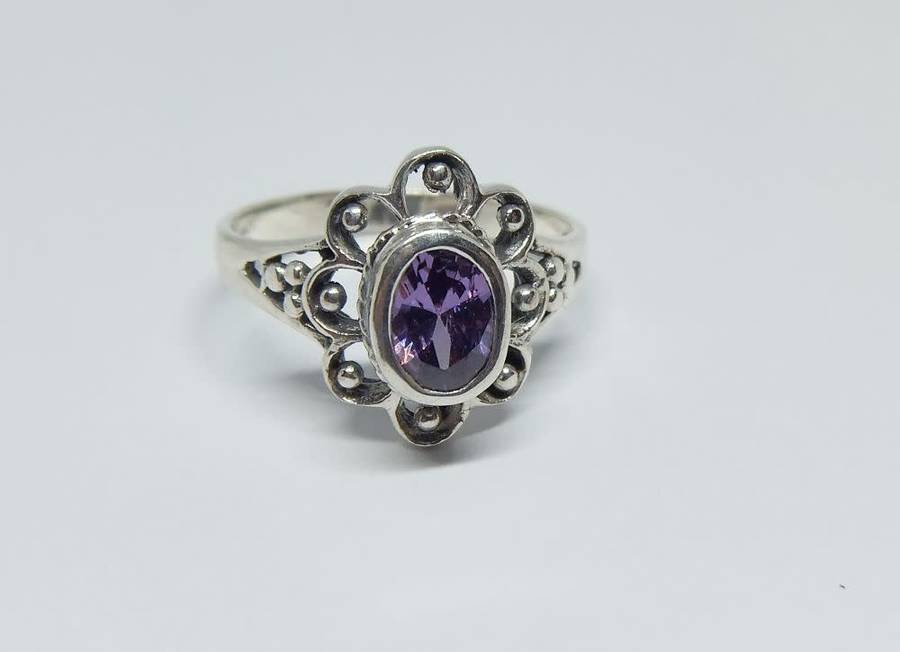 A genuine sterling silver ring with a faceted purple inset - Brand new - With gift box