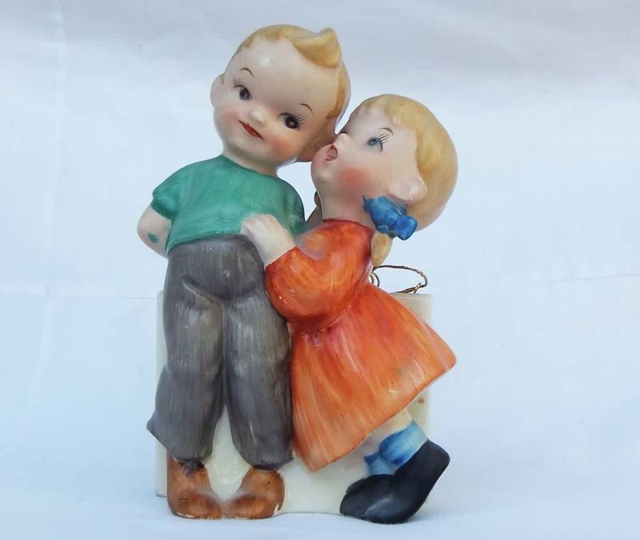 A very charming vintage Hummel look wall pocket or wall vase