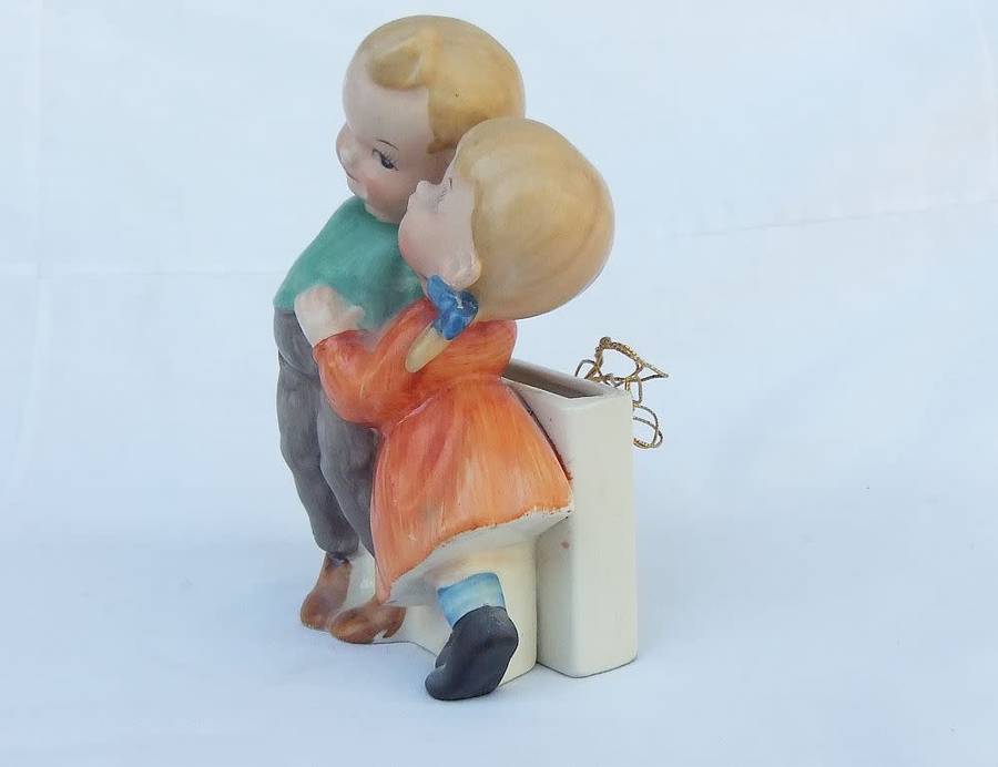 A very charming vintage Hummel look wall pocket or wall vase