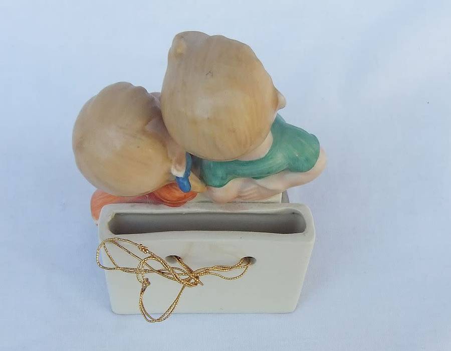 A very charming vintage Hummel look wall pocket or wall vase