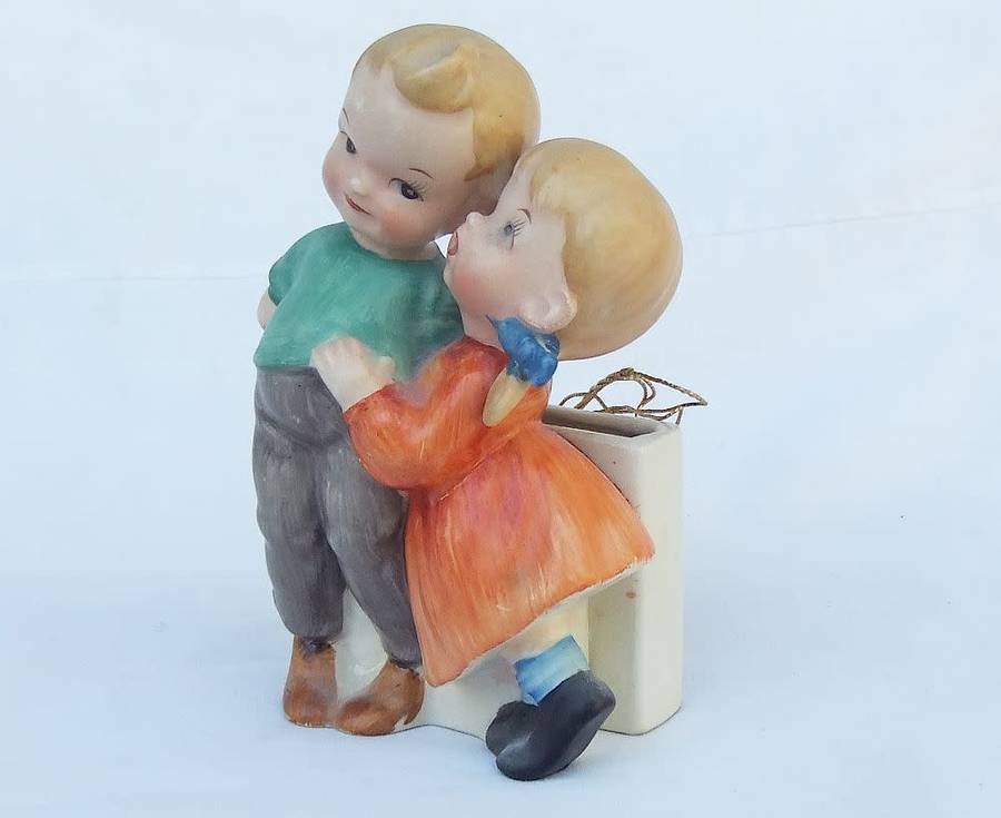 A very charming vintage Hummel look wall pocket or wall vase