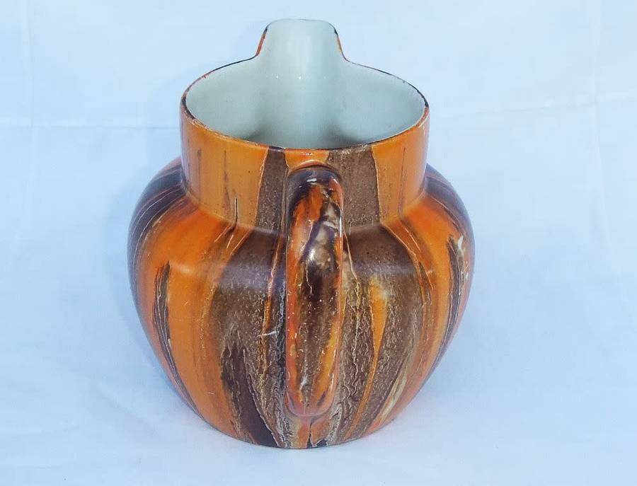 An eye catching Art Deco period hand painted porcelain jug by Myott , Son & Co