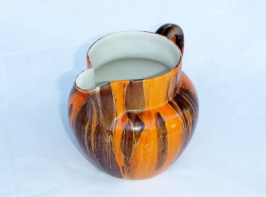 An eye catching Art Deco period hand painted porcelain jug by Myott , Son & Co
